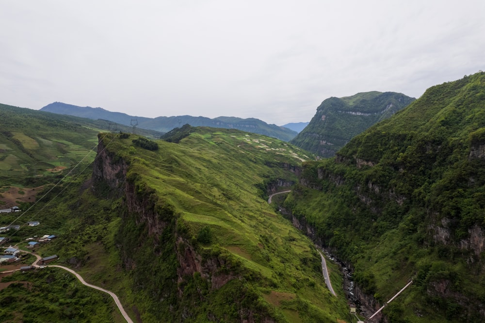 a scenic view of a mountain with a winding road