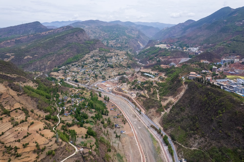 an aerial view of a town in the mountains