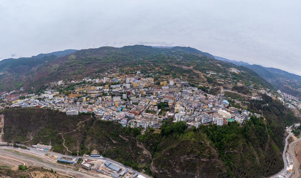 an aerial view of a city in the mountains