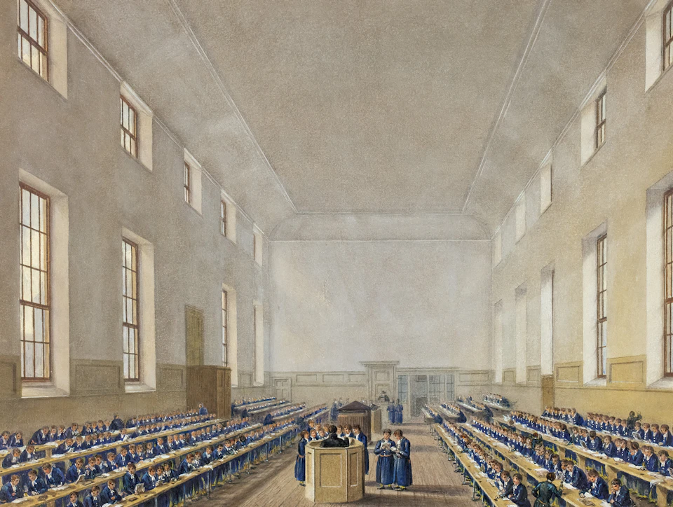 The image depicts a grand, spacious room with high ceilings and large windows that allow natural light to flood the space. The walls are painted white, creating an airy atmosphere. In the center of the room, there is a stage where a group of people can be seen gathered around it. A podium stands on the stage, suggesting a formal event or gathering taking place in this hallowed space.