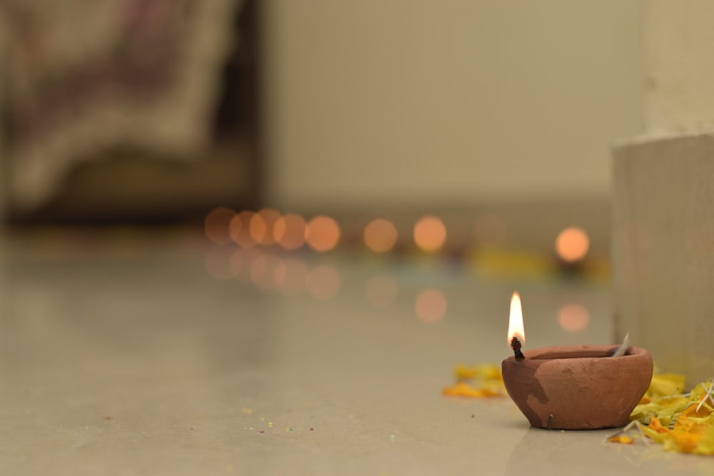 a small candle that is sitting on the ground