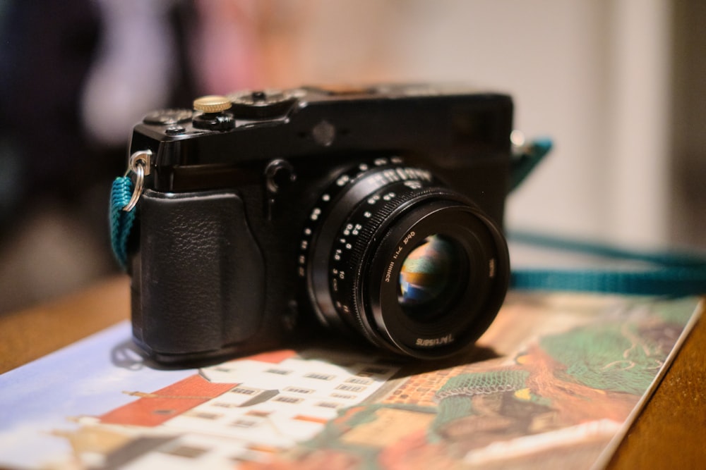 a camera sitting on top of a wooden table