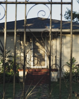 Elegant townhouse with small front yard and wrought iron gate