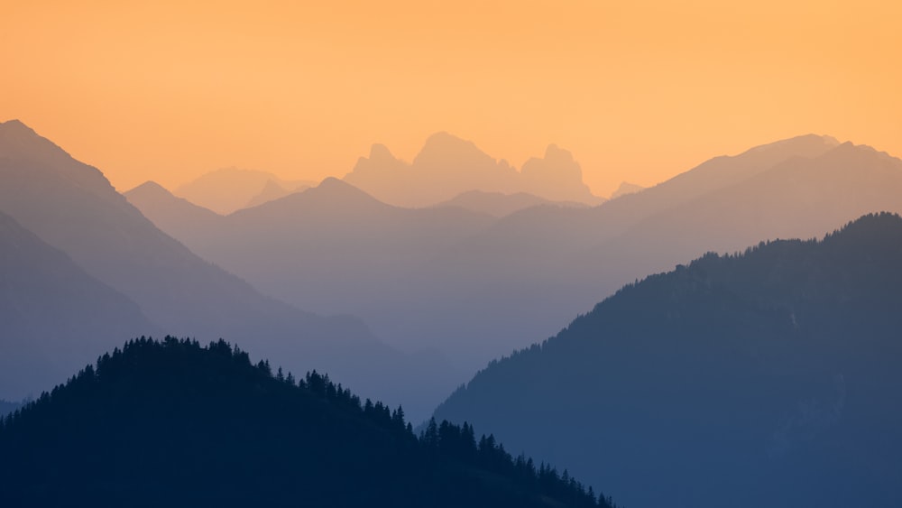 a view of a mountain range at sunset