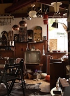 a room filled with lots of clutter and a tv