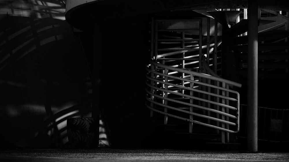 a black and white photo of a spiral staircase