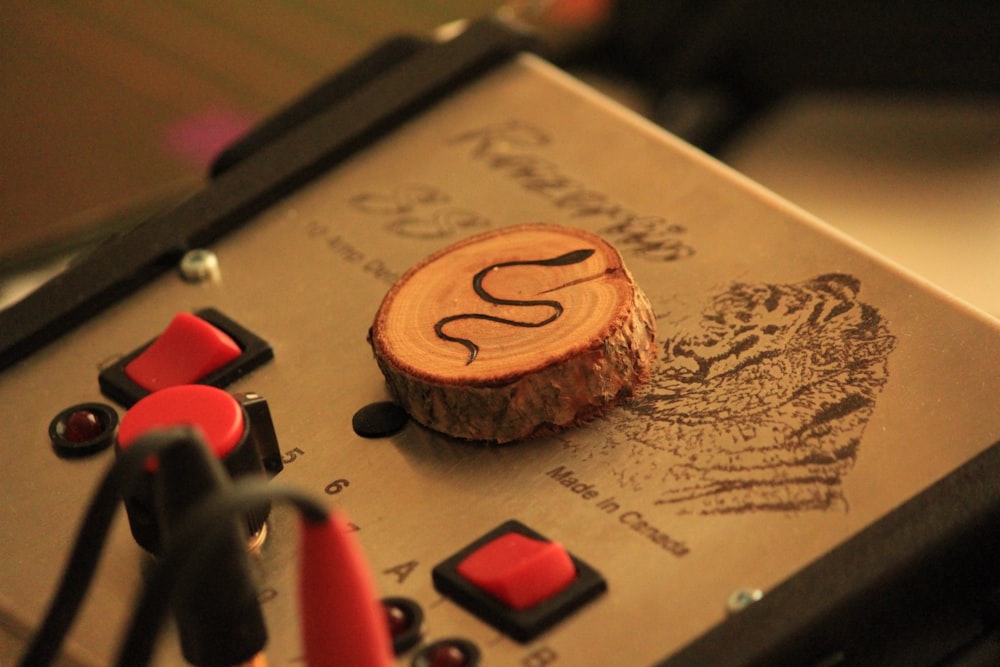 a close up of a piece of wood with the letter s on it