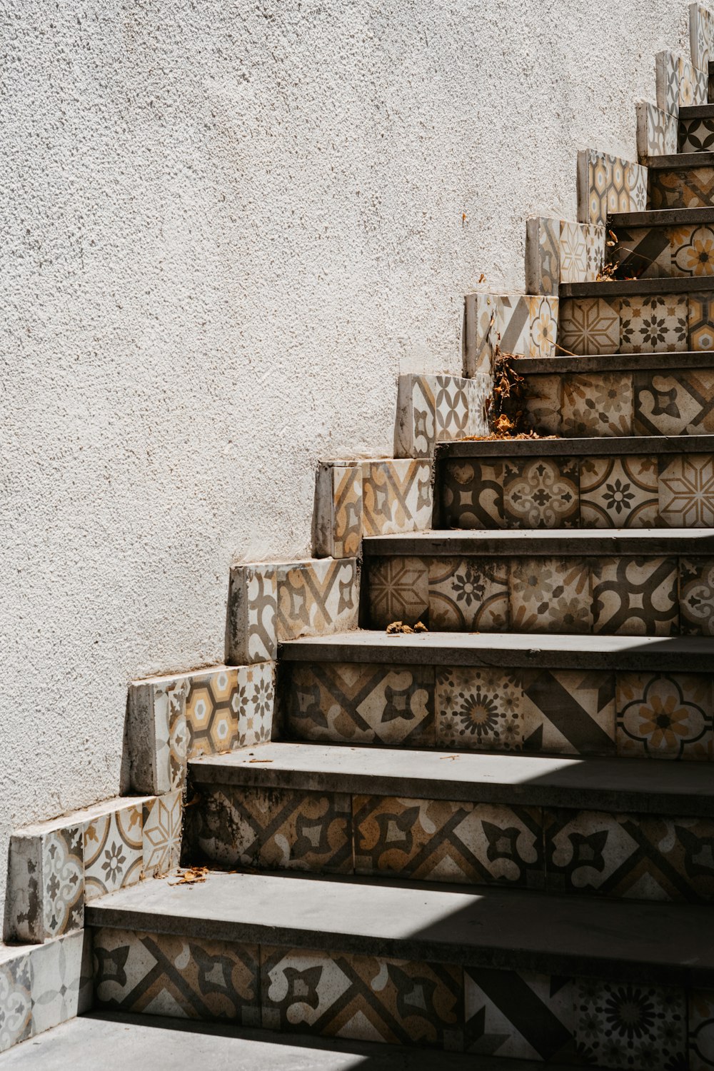 a close up of a set of stairs near a wall