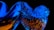 An abstract, digital artwork featuring a shiny, metallic texture interwoven with jagged, crystalline shapes. Vibrant blue and fiery orange colors dominate the twisted and intricate composition, set against a dark background that enhances the glowing effect.
