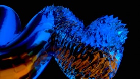 An abstract, digital artwork featuring a shiny, metallic texture interwoven with jagged, crystalline shapes. Vibrant blue and fiery orange colors dominate the twisted and intricate composition, set against a dark background that enhances the glowing effect.