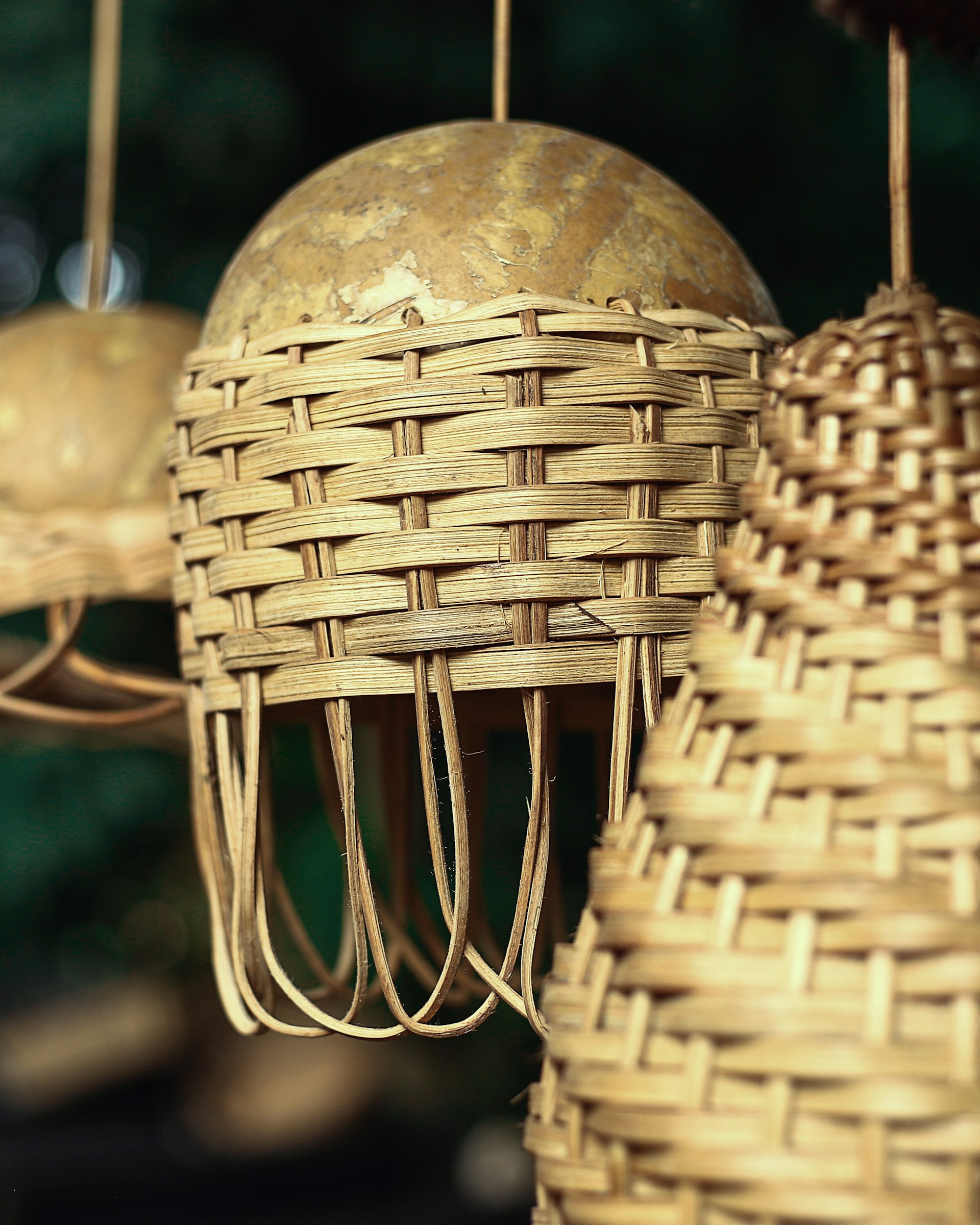 a bunch of baskets hanging from a ceiling