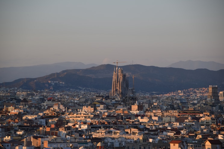 a view of a city with mountains in the background