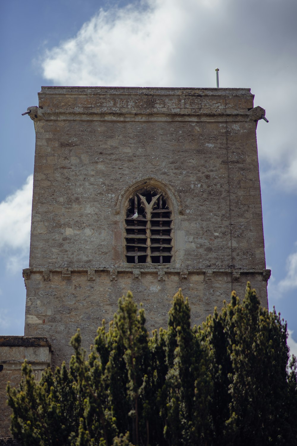 a tall tower with a clock on the top of it