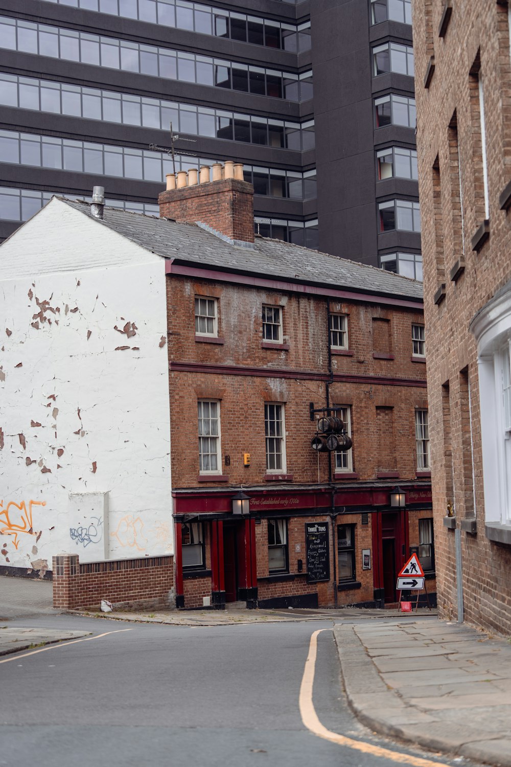 a street corner with a building in the background