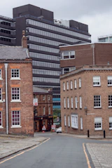 a city street with buildings in the background