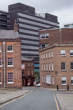 a city street with buildings in the background