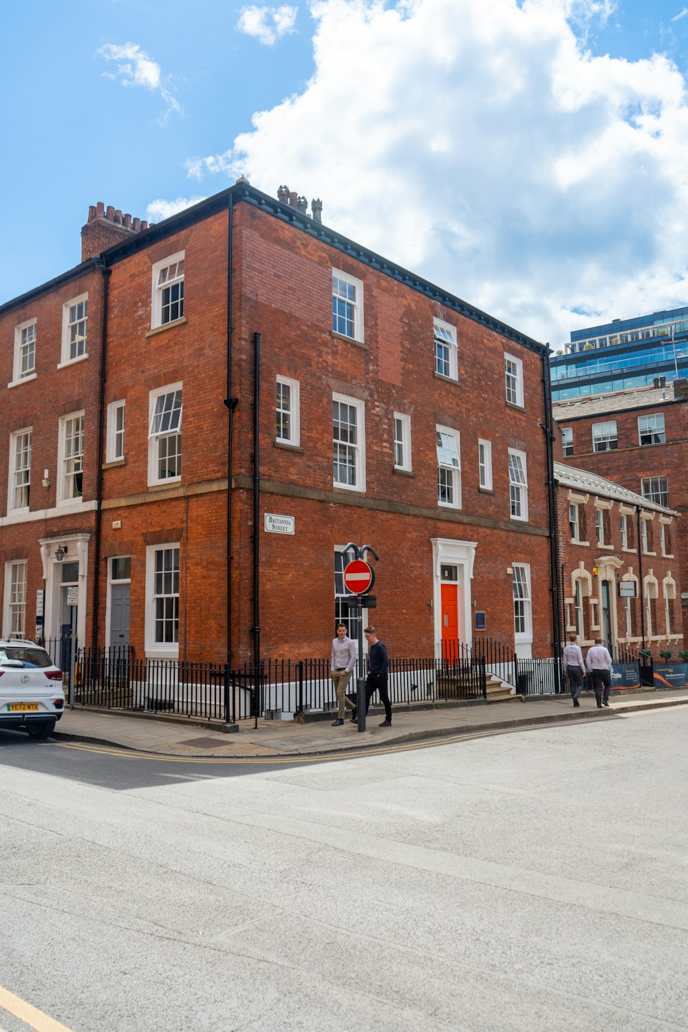 a red brick building on a street corner