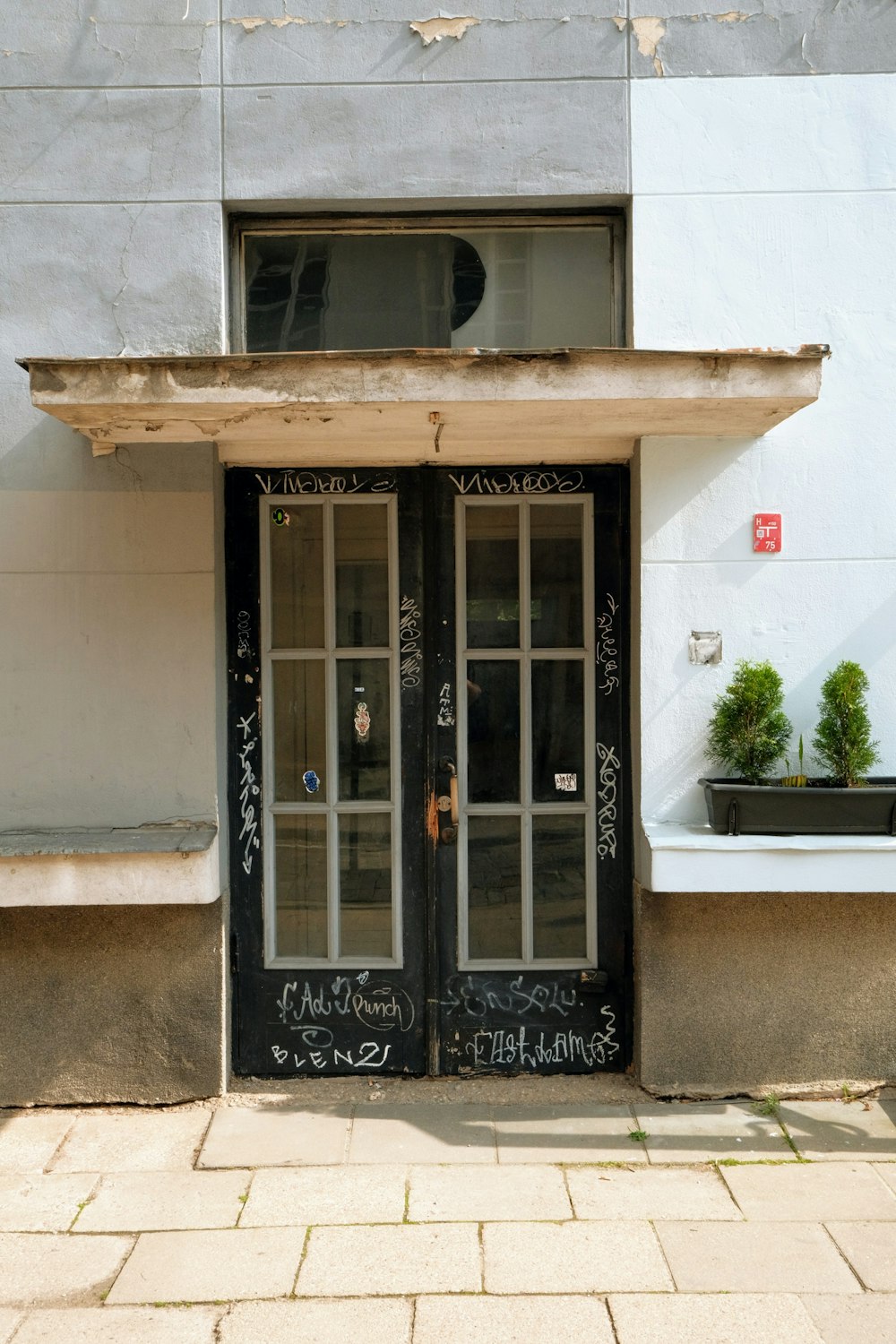 a building with a black door and windows