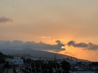 Sunrise over downtown Phoenix with warm desert hues lighting up the skyline