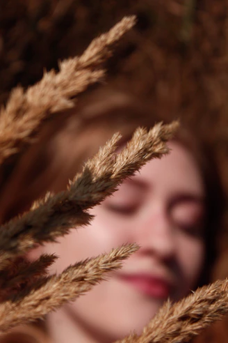 a close up of a woman with her eyes closed