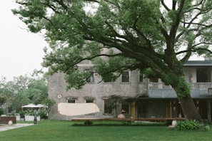A family enjoying the garden area of a property listed by real estate specialist in B-17