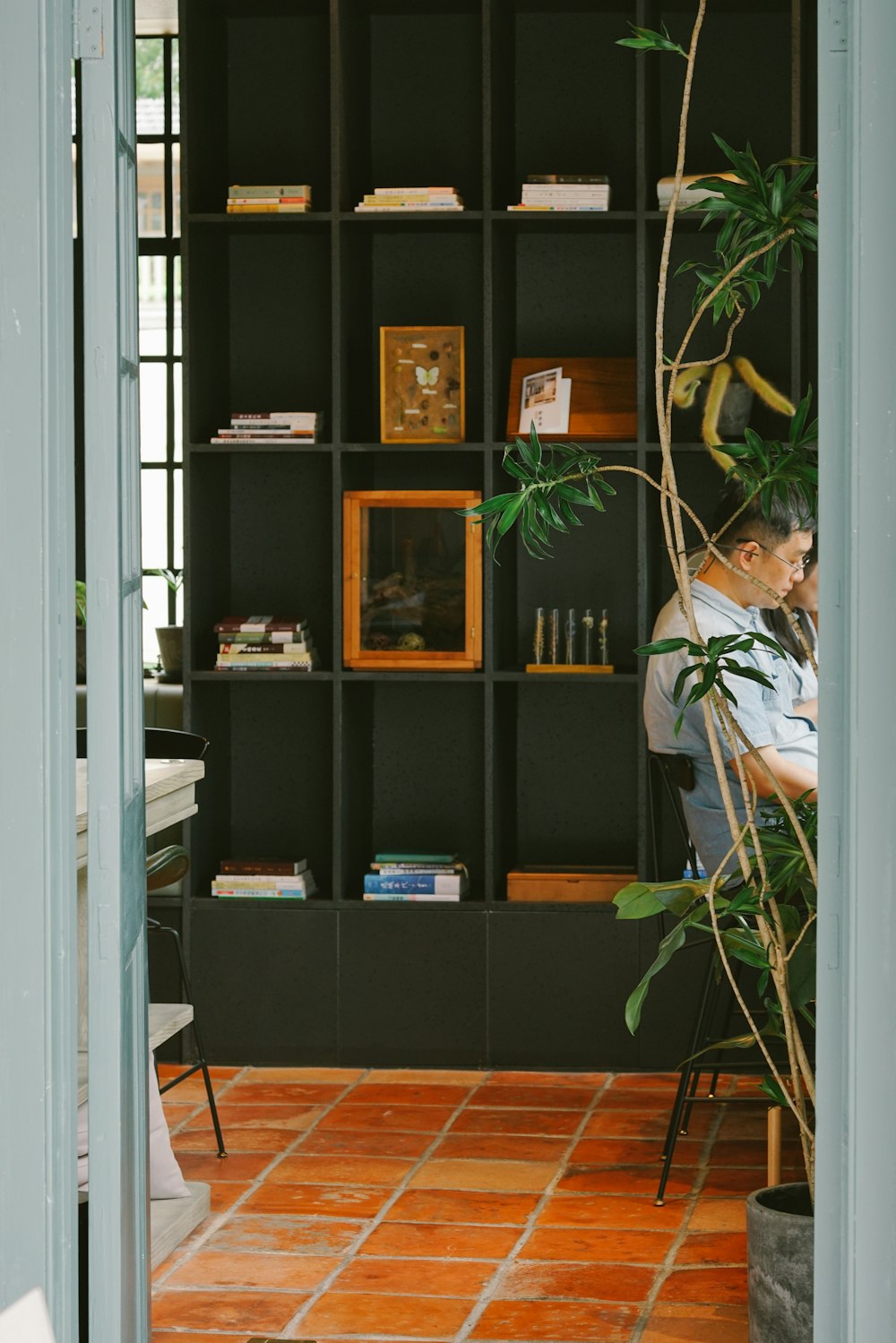 a man sitting at a desk in a room