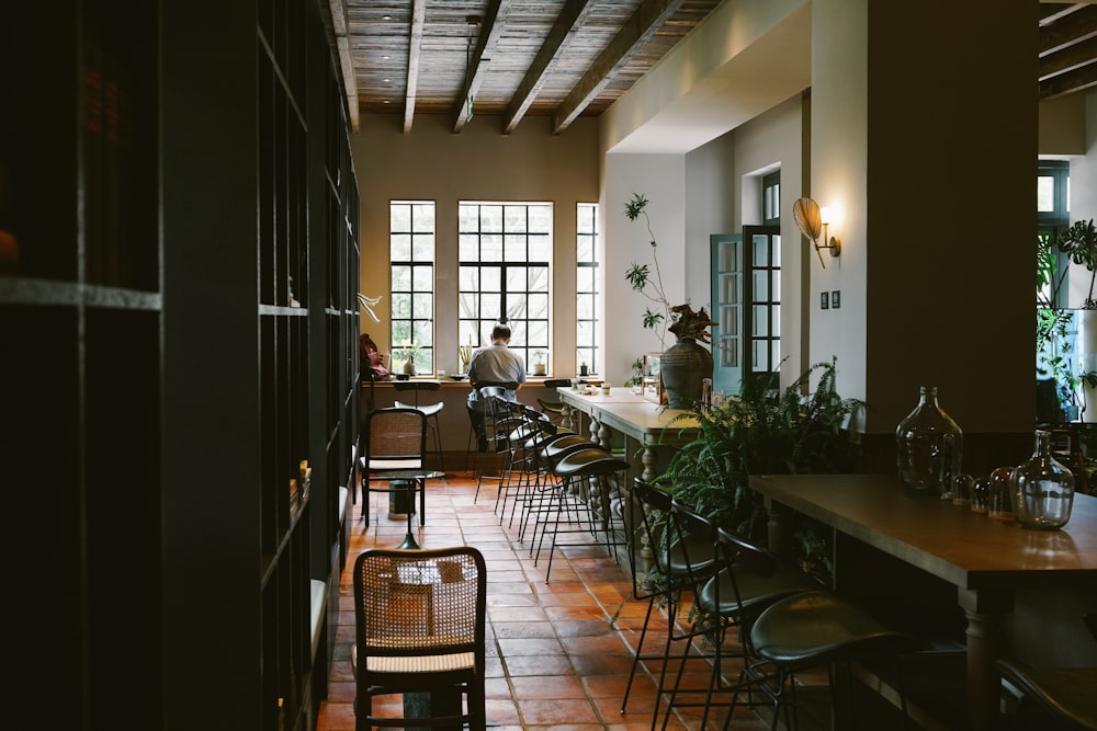 a man sitting at a table in a restaurant