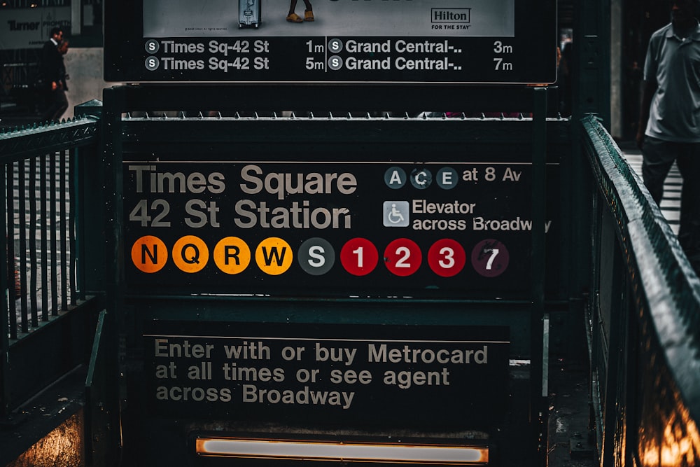 a bus stop with a sign that says times square and 42 st station