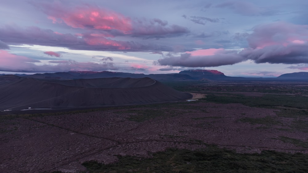 a view of a mountain range at dusk