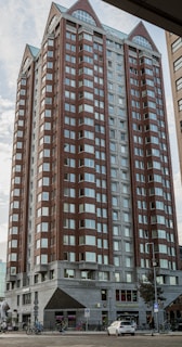 Street-level perspective of the Liberty Building at 635 S Front St, highlighting retail storefronts and apartment windows above.