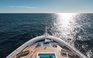 a view of the back of a boat in the ocean