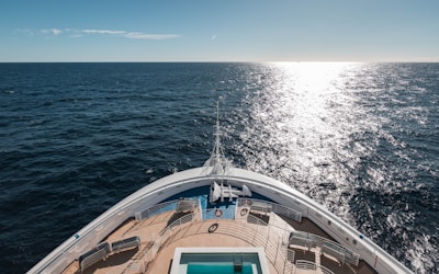 a view of the back of a boat in the ocean