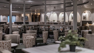 Elegant lounge area with classic Parisian decor and soft lighting.