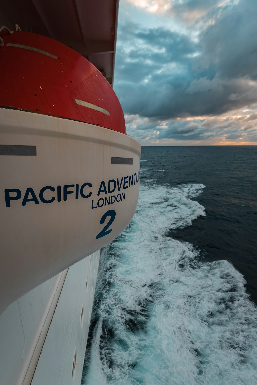 the back of a boat traveling through the ocean