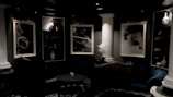Inviting lounge area with plush seating and traditional Greek artwork.