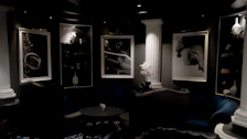 Inviting lounge area with plush seating and traditional Greek artwork.