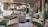 A stylish and elegant lounge area features plush seating with a mix of green and gray armchairs. Zebra-patterned cushions and footrests add a playful touch to the sophisticated decor. The space includes potted plants, enhancing the fresh and modern atmosphere. A polished wooden bar with a circular design and ambient lighting is positioned at the back, creating a welcoming focal point.