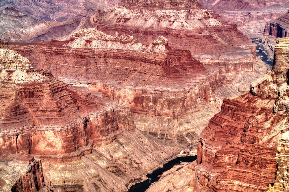 a view of a canyon with a river running through it