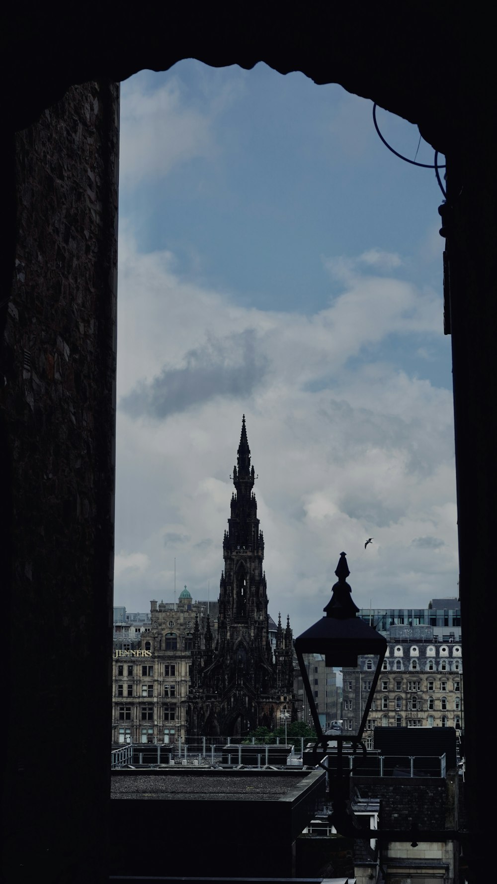 a tall building with a clock tower in the background