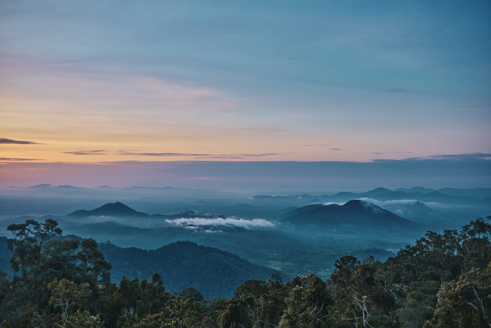 a view of a mountain range at sunset