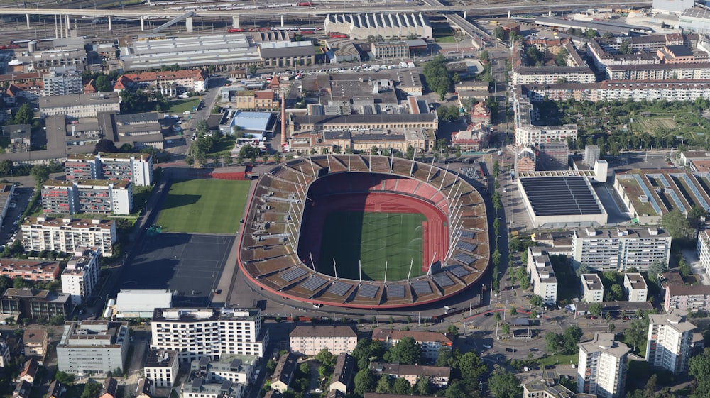 an aerial view of a soccer stadium in a city