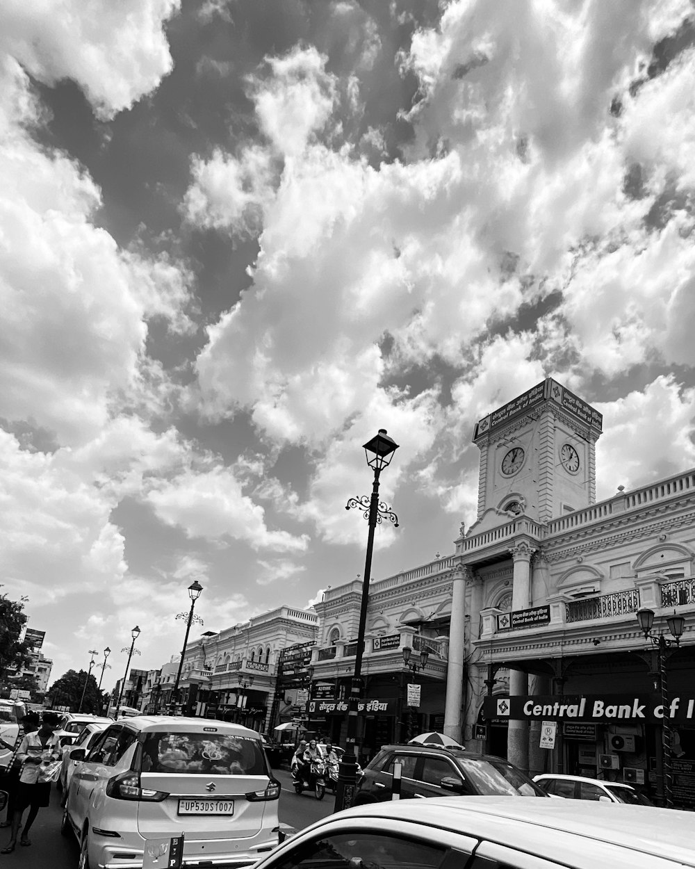 a black and white photo of a busy street