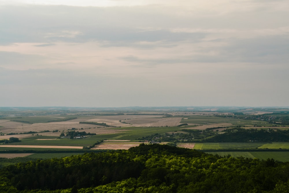 a view of the countryside from the top of a hill