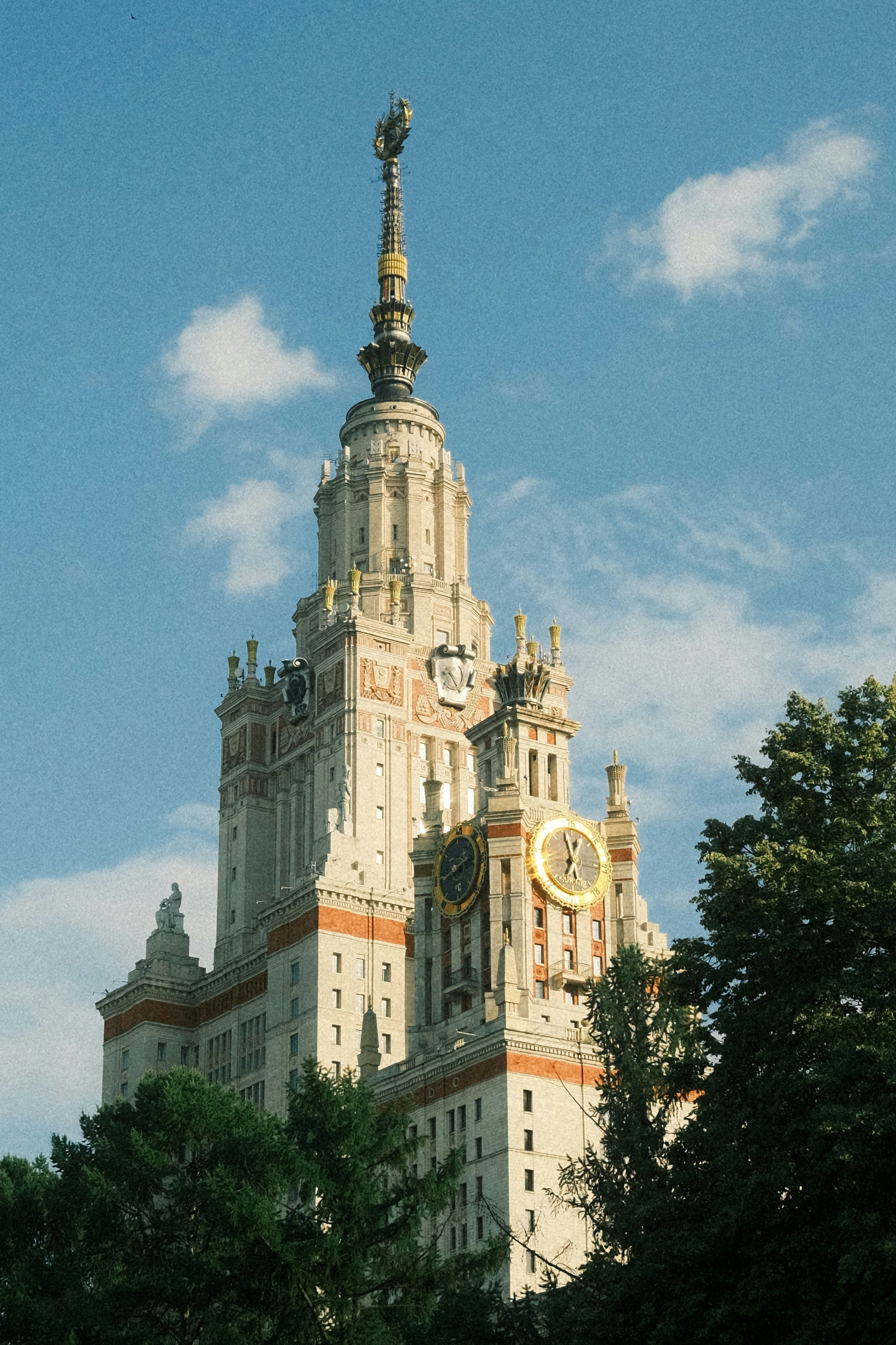 a tall building with a clock on the top of it
