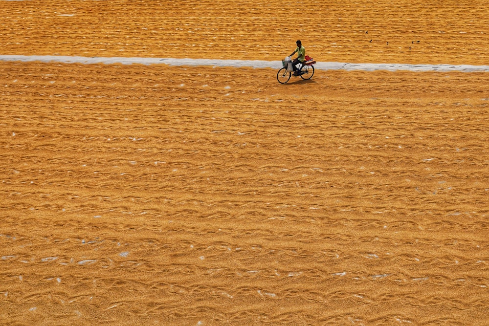 a person riding a motorcycle on a dirt field