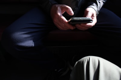 Two hands holding a smartphone with the vpanties app interface glowing.