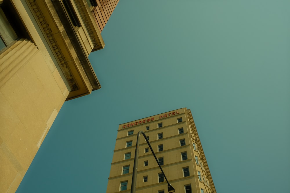 looking up at a tall building from the ground