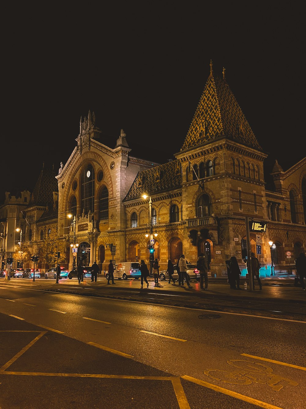 a large building with a clock tower at night