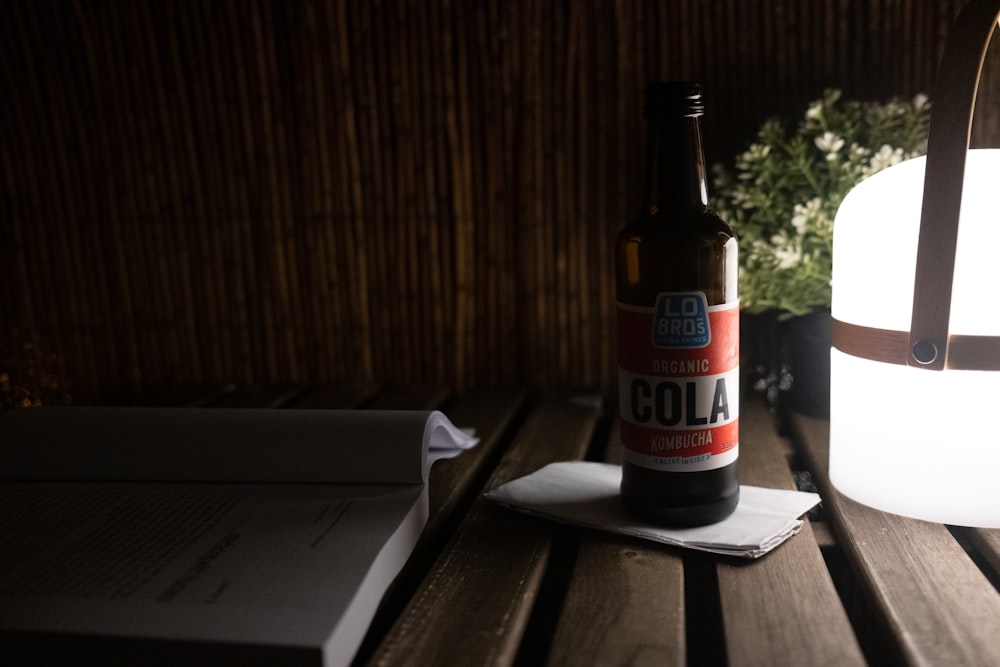 a beer bottle sitting on top of a wooden table