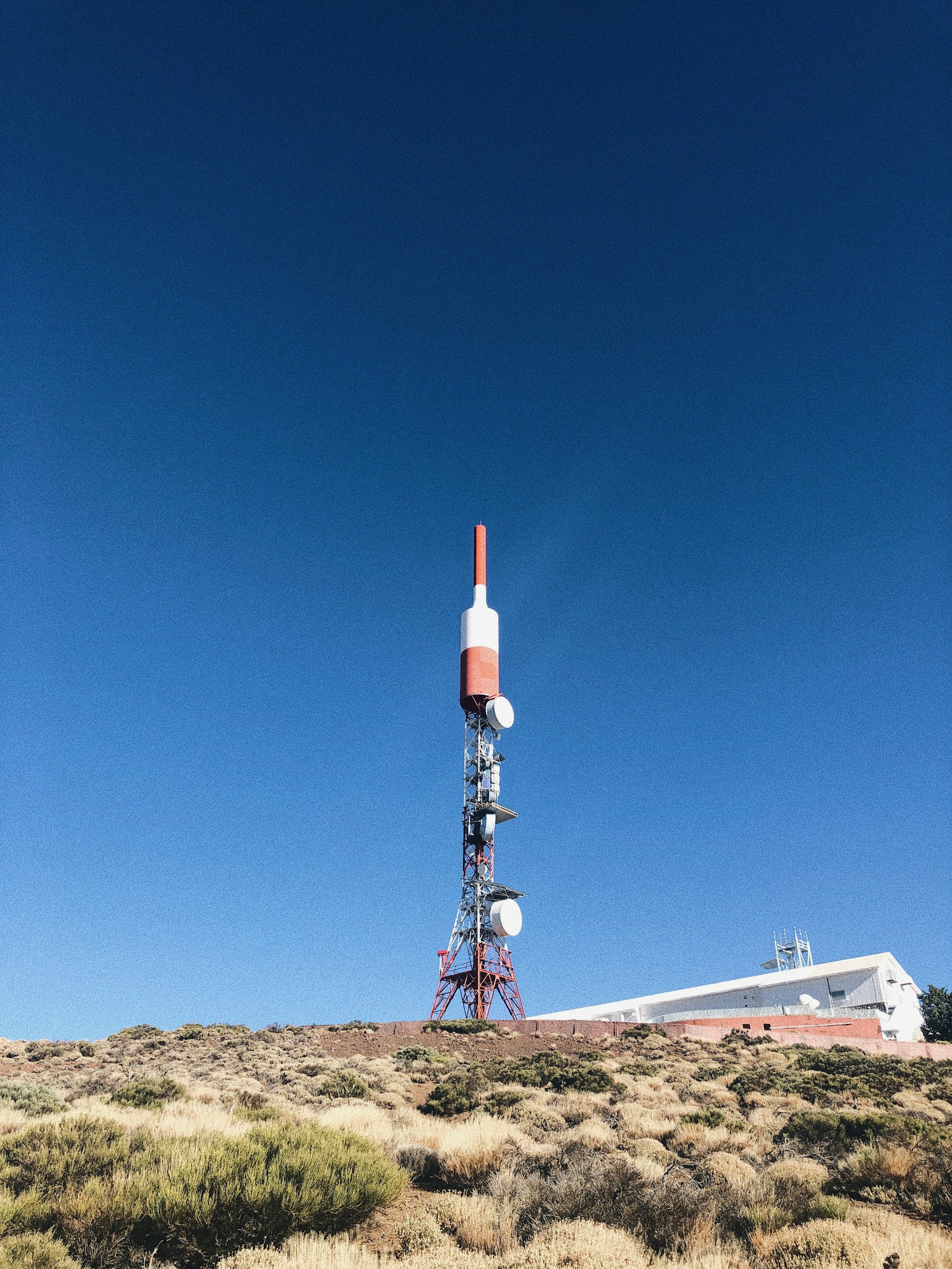 woman wearing yellow long-sleeved dress under white clouds and blue sky during daytime